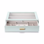 SortWithStyle aqua jewelry organizer displayed on modern vanity desk with organized necklaces, earrings, and accessories